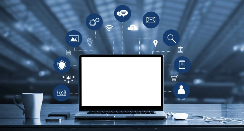 A laptop with a blank screen surrounded by digital icons representing cloud storage, security, analytics, email, media, and e-commerce, symbolizing digital marketing and online connectivity.